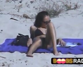 Large jugged dark haired took off her top on the beach, wanting her titties to suntan a bit