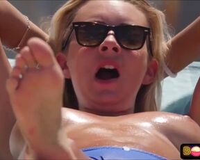 Bare-Chested damsel doesn't give a sex that everyone is gawping at her boobies, on the beach