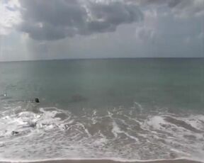Lonely Chinese lady is showcasing her bare, moist bod, with enjoyment, while on the beach
