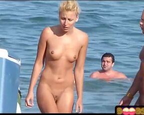 Thin lady got entirely bare on the beach, knowing that people will gaze at her twat