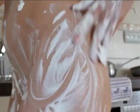 Strip fetish art food in the kitchen. Boobs and pussy of a beautiful girl in close-up