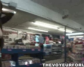 Busty babe bares it all at the porn store