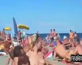 Horny voyeur is watching, while horny couples are having sex on the public nude beach