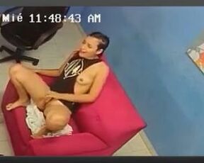 Cute brunette is sitting and rubbing her warm pussy, while a voyeur is making a video